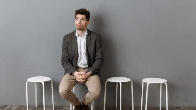 a man sitting before meeting